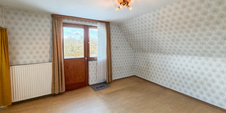 Schlafzimmer mit Zugang zur Dachterrasse